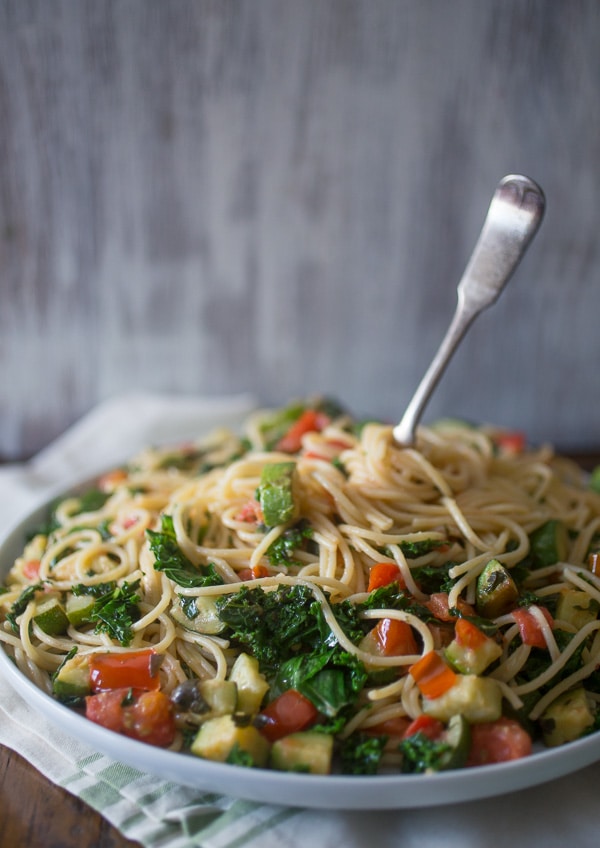 This zucchini tomato kale pasta packs all the flavors of summer into one pasta dish. Simple to throw together and ready in under 30 minutes!