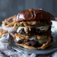 This chorizo beef burger with crispy onion straws is the perfect big mouth burger. Topped with bbq fry sauce, candied jalapeños and American cheese.