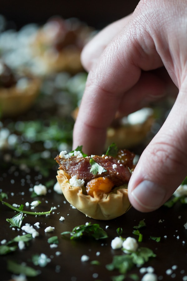 These mini steak fajita phyllo bites are the perfection combination of guacamole, peppers, steak, cheese and cilantro all in one mini phyllo cup bite.