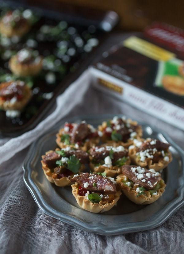These mini steak fajita phyllo bites are the perfection combination of guacamole, peppers, steak, cheese and cilantro all in one mini phyllo cup bite.