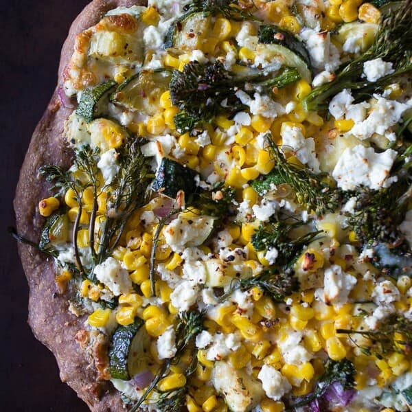 This zucchini corn feta pizza is the perfect way to say goodbye to summer. Packed full of fresh vegetable flavor, cheesy feta and fresh herbs all on a whole wheat crust.