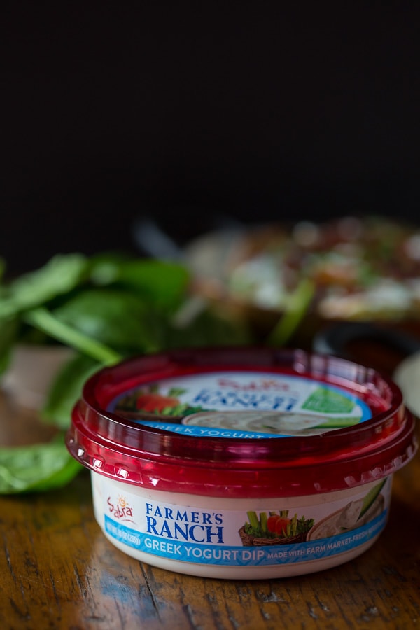 These spinach bacon ranch twice baked potatoes are packed full of flavor and made with a secret ingredients - Greek yogurt ranch dip. So delicious and PACKED full of flavor. They make a great side dish or a main course.
