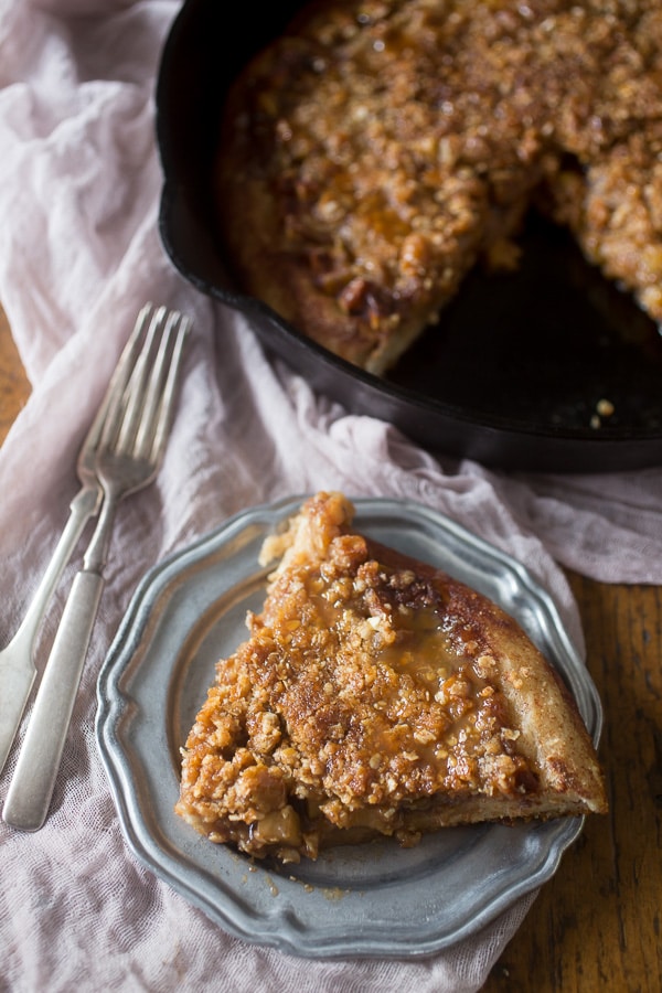 Caramel Apple Crisp Pizza on a metal plate with a fork and napkin. 