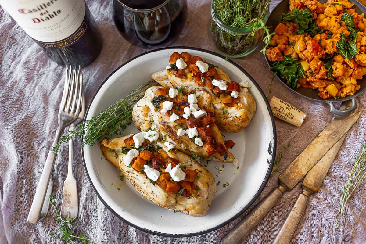 Cornbread Stuffed Chicken served with extra filling and wine. 