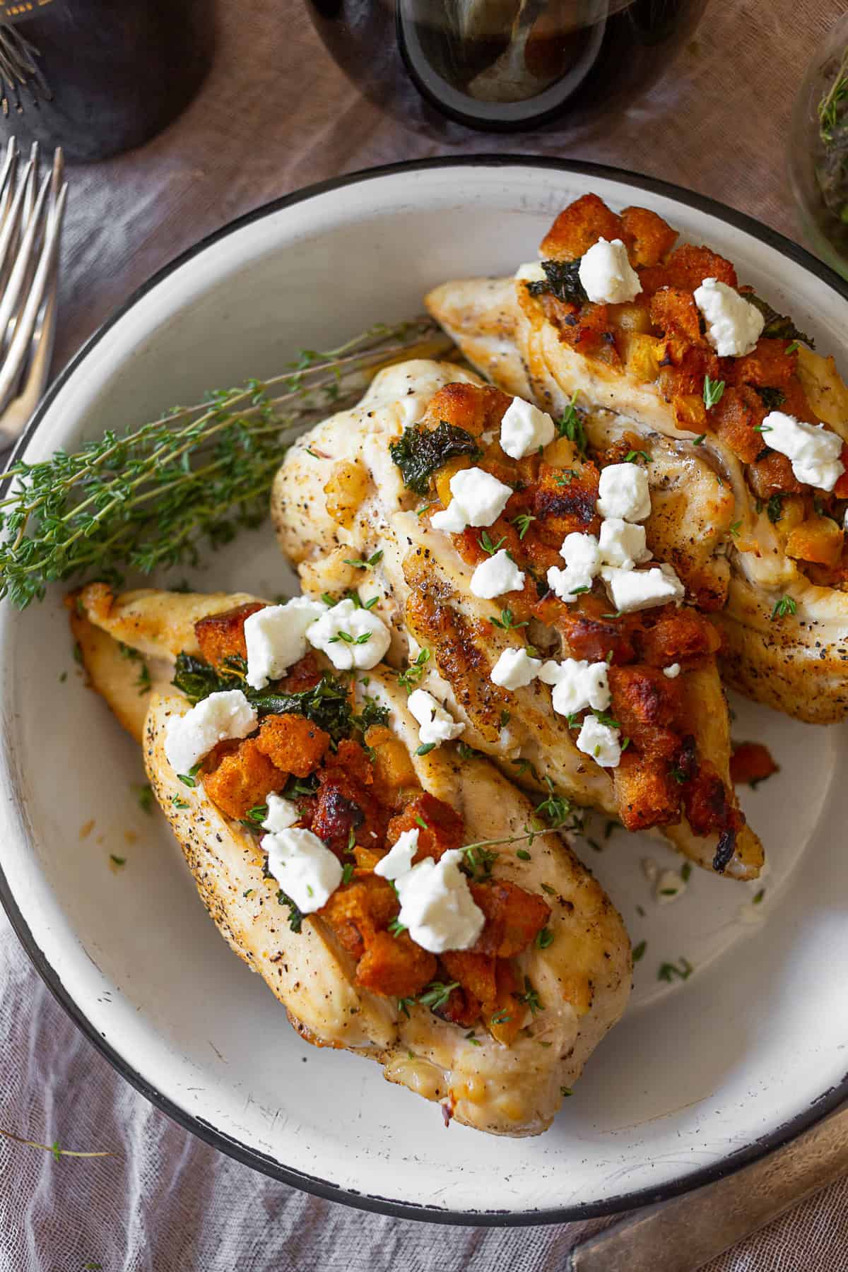 Cornbread Stuffed Chicken in a baking dish. 