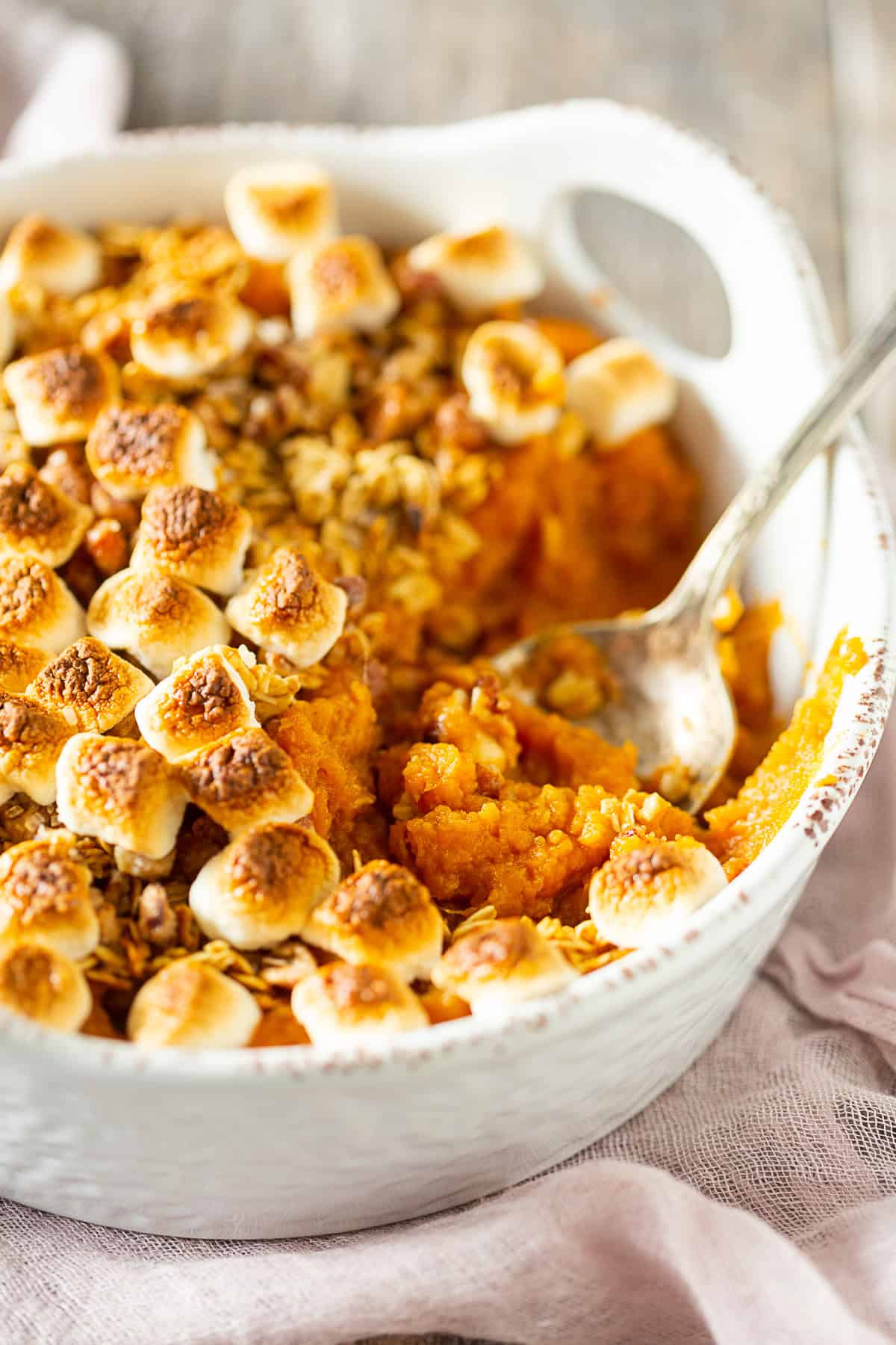 Vanilla Sweet Potato Casserole with a spoon in the dish. 
