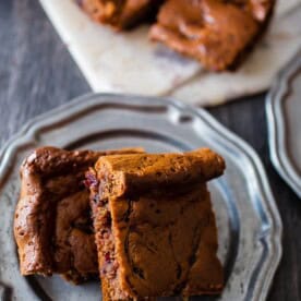 These paleo gingerbread blondies are packed full of holiday flavor. 100% Paleo made with almond butter, honey, warm spices and black currant jam.