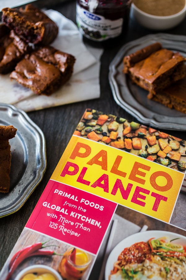 These paleo gingerbread blondies are packed full of holiday flavor. 100% Paleo made with almond butter, honey, warm spices and black currant jam.