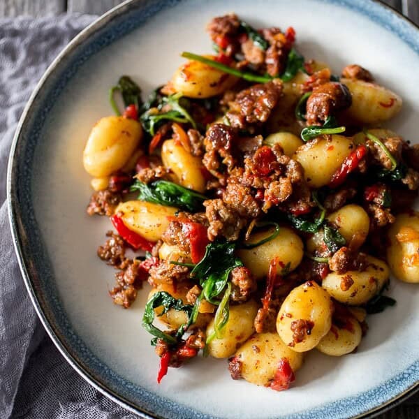 chorizo red pepper spinach gnocchi on a plate