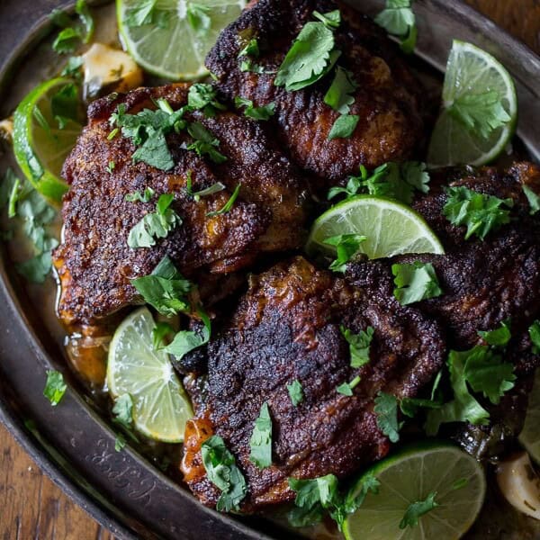 These cilantro lime chicken thighs are crispy, packed full of fresh flavor and ready in under an hour! Talk about easy and delicious!