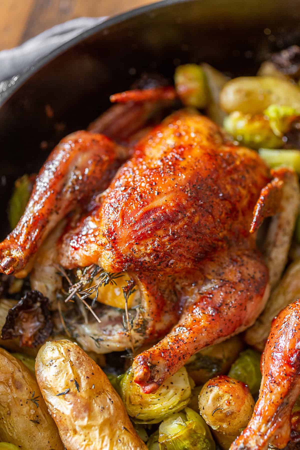 Cranberry BBQ Sauce Cornish Hens in a cast iron skillet. 