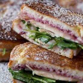 This turkey monte cristo is made with cranberry sauce, arugula, leftover turkey and Swiss cheese. Perfectly grilled and gluten free! This is the perfect sandwich for using up all those Thanksgiving leftovers!
