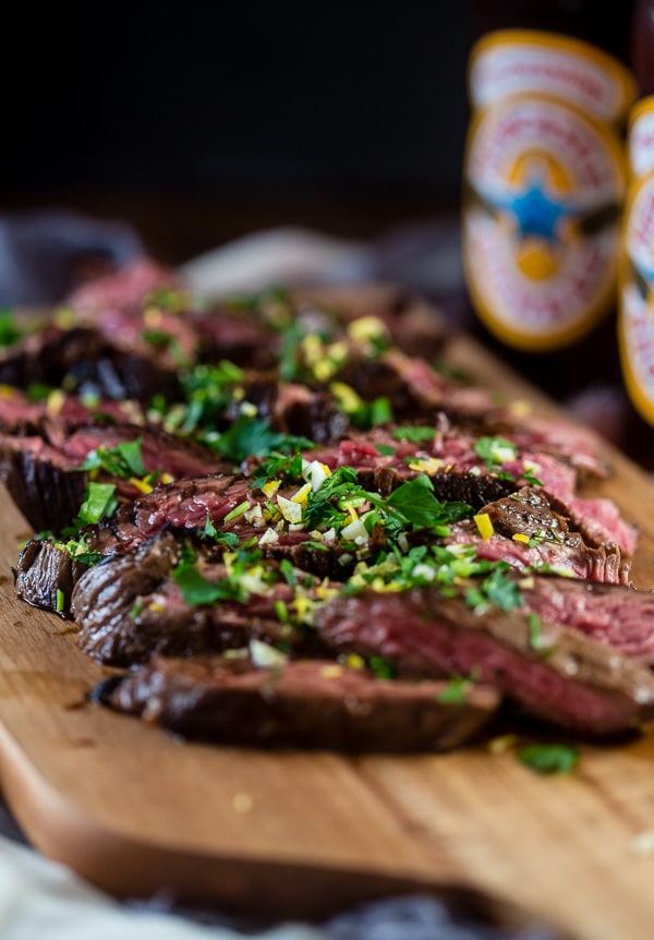 This Newcastle brown ale marinated hanger steak is the perfect holiday meal. Perfectly cooked and topped with Newcastle caramelized onions. You need this!