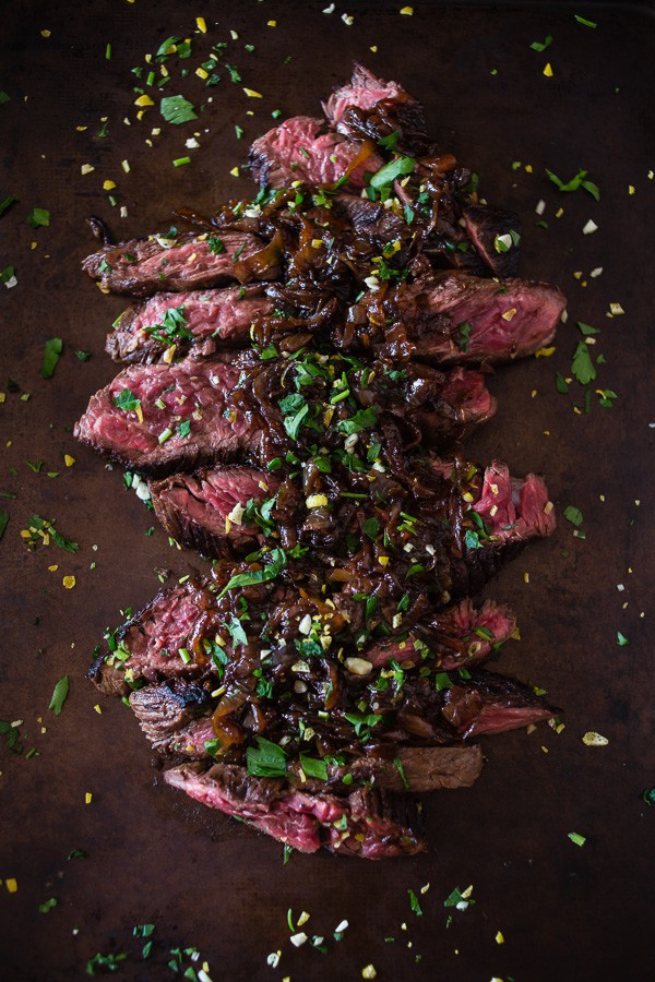 This Newcastle brown ale marinated hanger steak is the perfect holiday meal. Perfectly cooked and topped with Newcastle caramelized onions. You need this!