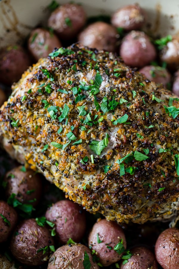This citrus herb crusted pork roast is perfect for the holidays. Rubbed down with flavor packed topping and roasted with small baby potatoes. Easy and delicious!