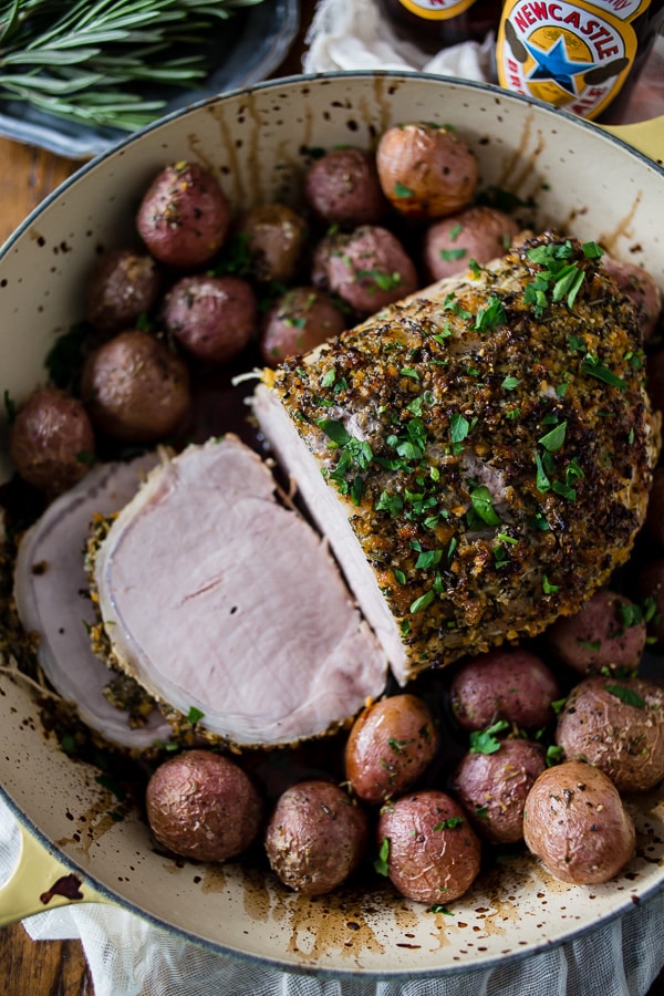 This citrus herb crusted pork roast is perfect for the holidays. Rubbed down with flavor packed topping and roasted with small baby potatoes. Easy and delicious!