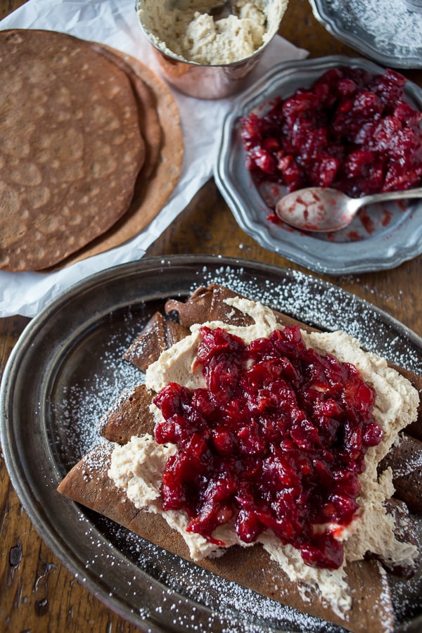 These gingerbread crepes with ginger cranberry compote are the perfect winter dessert. Full of fluffy vanilla mascarpone filling and ready in under an hour!