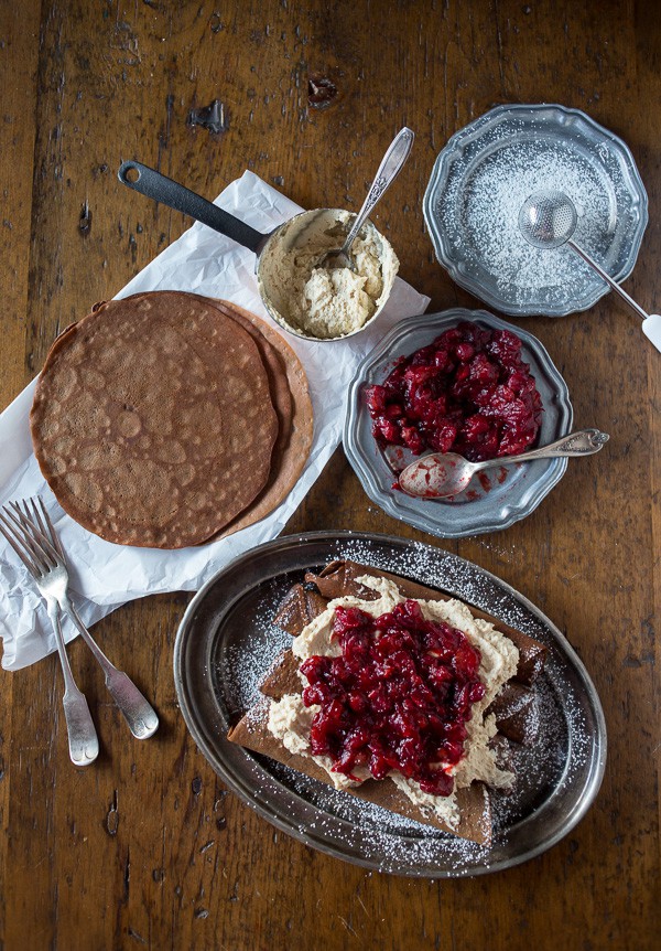 These gingerbread crepes with ginger cranberry compote are the perfect winter dessert. Full of fluffy vanilla mascarpone filling and ready in under an hour!