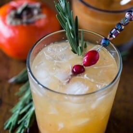 This persimmon old fashioned cocktail is a tasty winter libation. Made with a sweet persimmon puree, rye and just a touch of seltzer. So easy to make and drink!