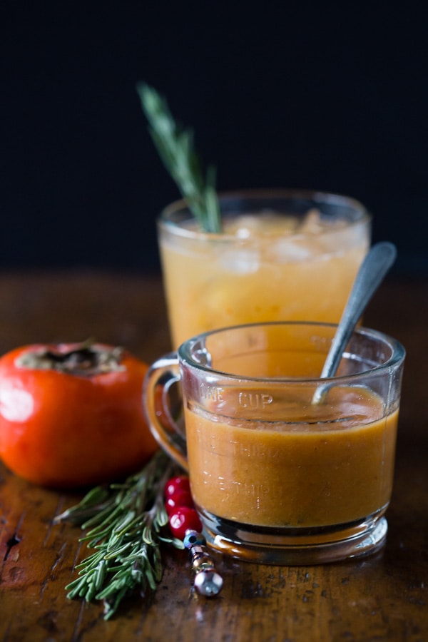 Persimmon puree with a Persimmon Old Fashioned Cocktail in the background. 