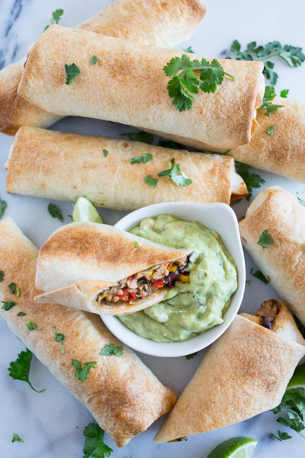 These baked Southwestern chicken egg rolls taste just like the ones you get at Chili's but without all the deep fried calories because they're baked! Ready in just 45 minutes and packed full of flavor. Perfect when served with guacamole ranch Greek yogurt dip. These baked Southwestern chicken egg rolls taste just like the ones you get at Chili's but without all the deep fried calories because they're baked! Ready in just 45 minutes and packed full of flavor. Perfect when served with guacamole ranch Greek yogurt dip.