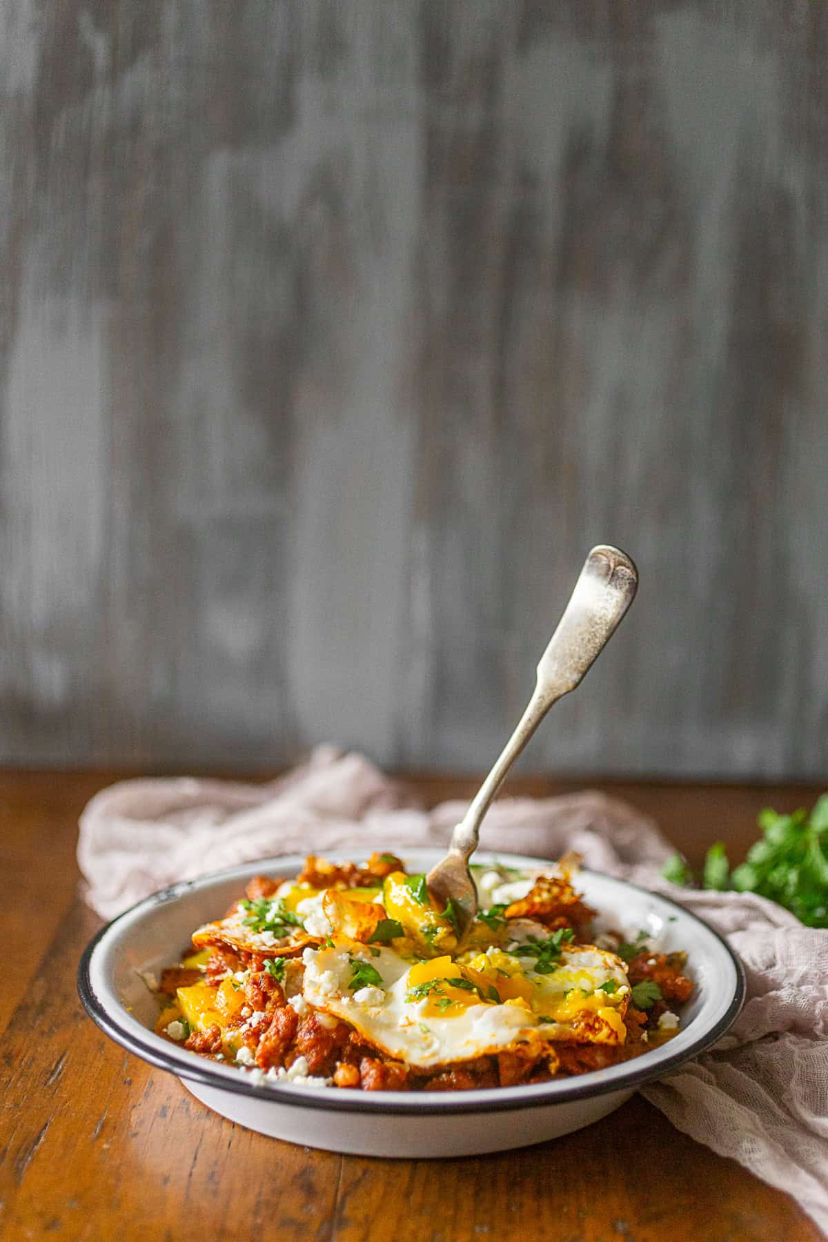 Chorizo Breakfast Hash in a dish with a fork.