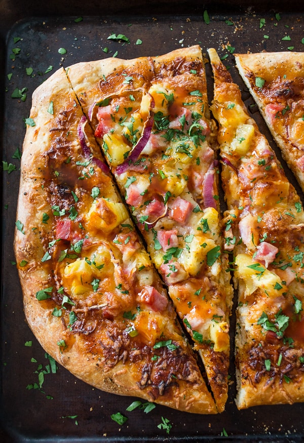 BBQ Hawaiian Pizza sliced on a sheet pan. 