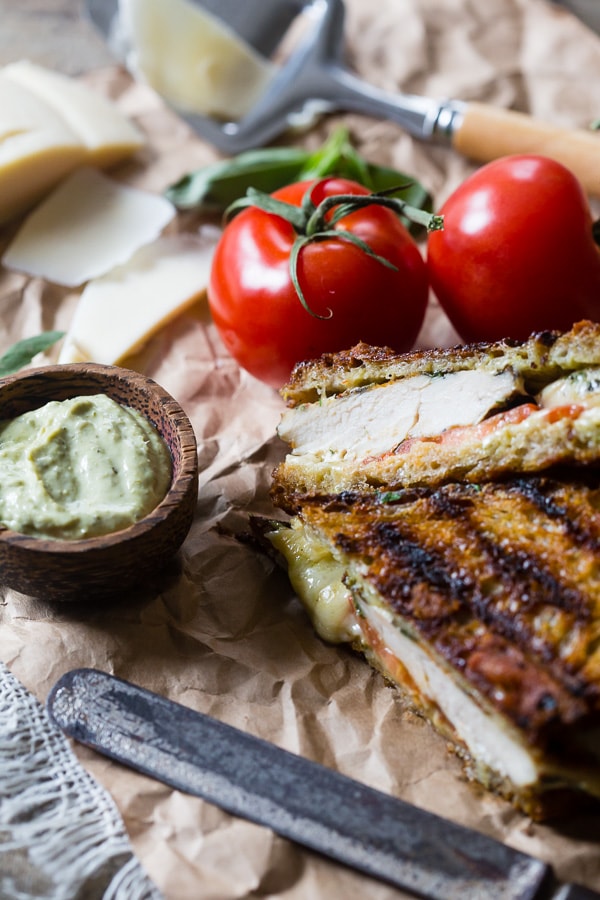 This grilled chicken pesto panini is a quick and easy weeknight meal. Made with grilled marinated chicken, sharp provolone cheese, pesto mayonnaise and ripe tomatoes. You'll love this sandwich so much you'll want to make it every single week!