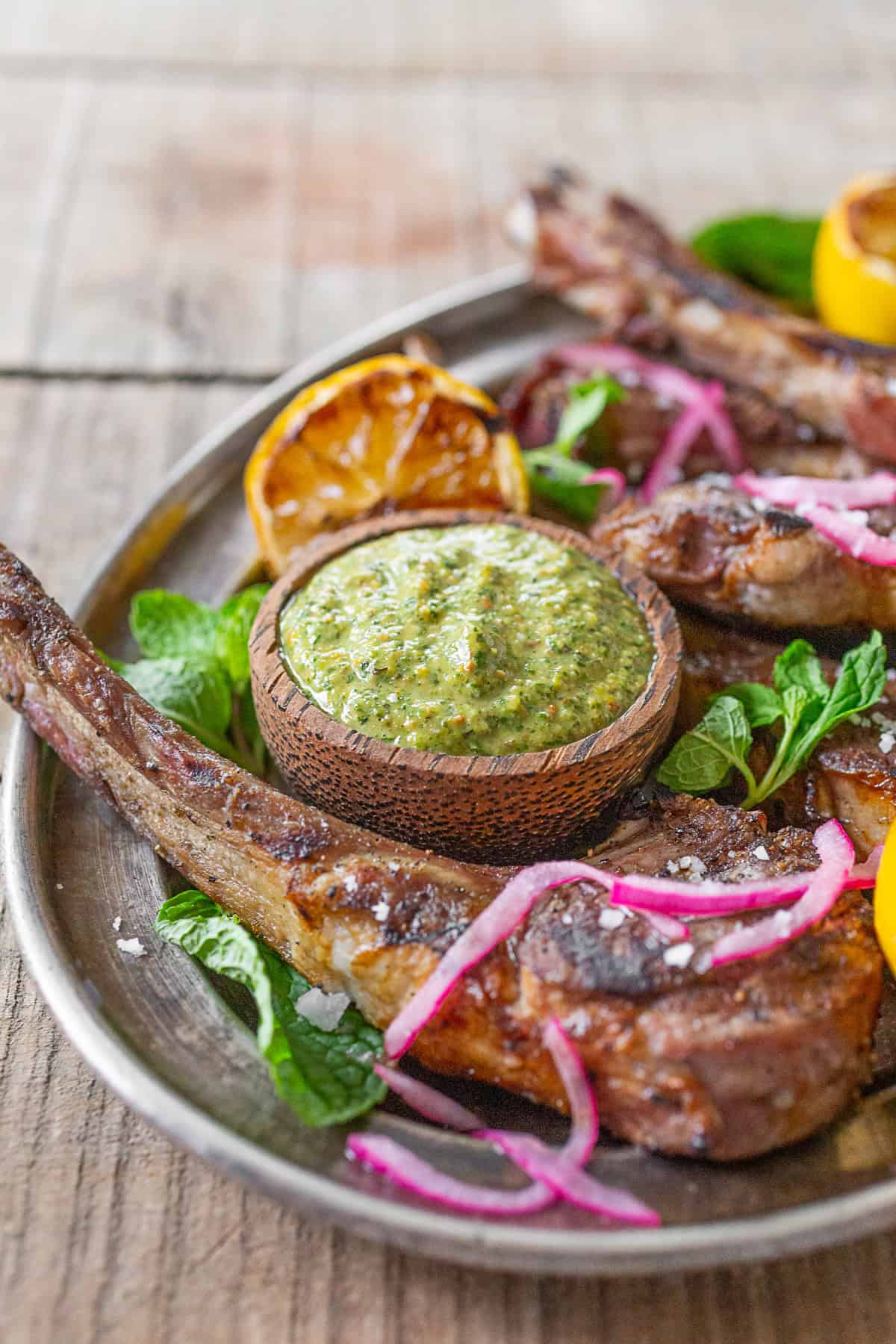 Grilled Lamb Chops with Pistachio Mint Pesto served with extra pesto.