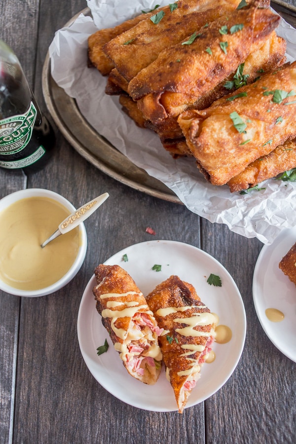 Reuben Egg Rolls served with mustard. 