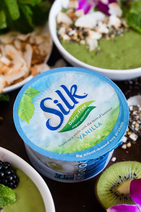 This tropical green smoothie bowl is made with frozen bananas, mango, kiwi, mint, spinach, chia seeds, vanilla soy yogurt and coconut milk. It's ready in just 5 minutes and tastes like a tropical paradise.
