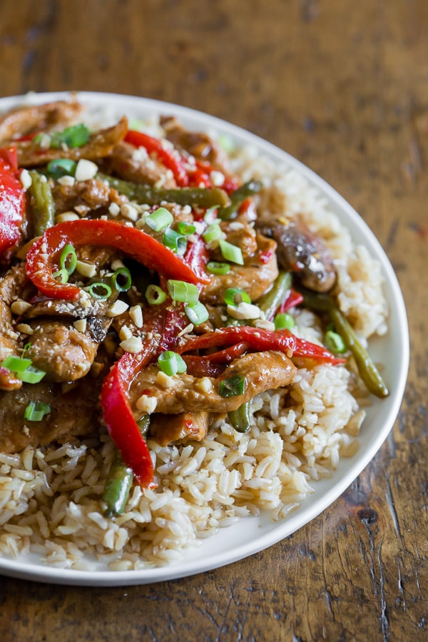 Spicy Garlic Pork Stir Fry on a plate with rice.