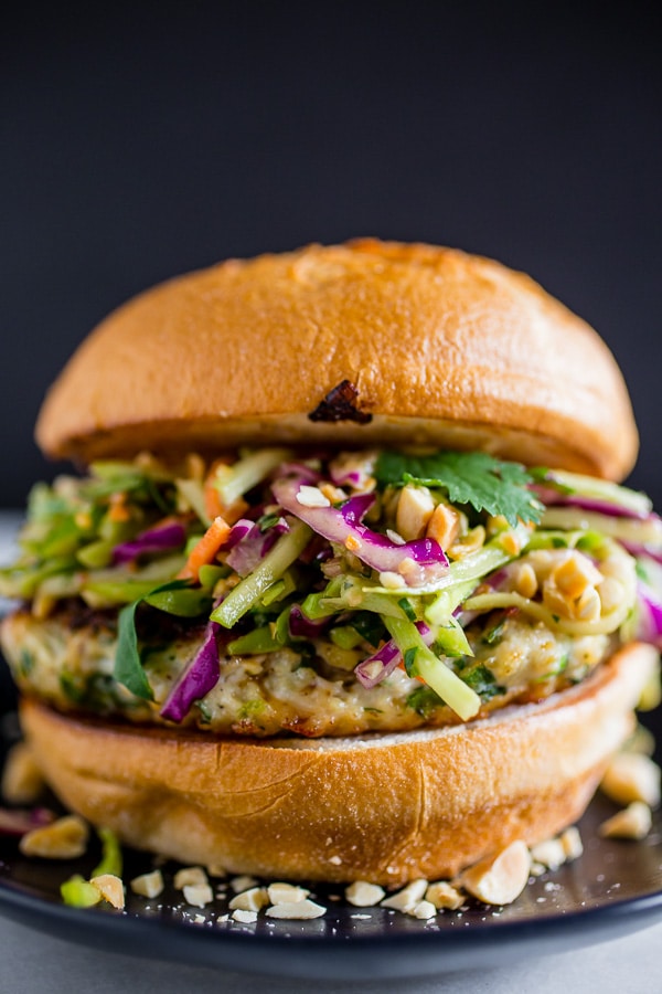 These Thai chicken burgers are packed full of fresh herbs and topped with a crunchy vegetable slaw tossed with a peanut butter dressing. Ready in about 30 minutes and LOADED with flavor!