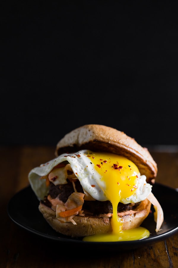 This kimchi burger is topped with a fried egg and TONS of kimchi. You'll love all the flavor that is PACKED into these burgers! Say goodbye to boring burgers.