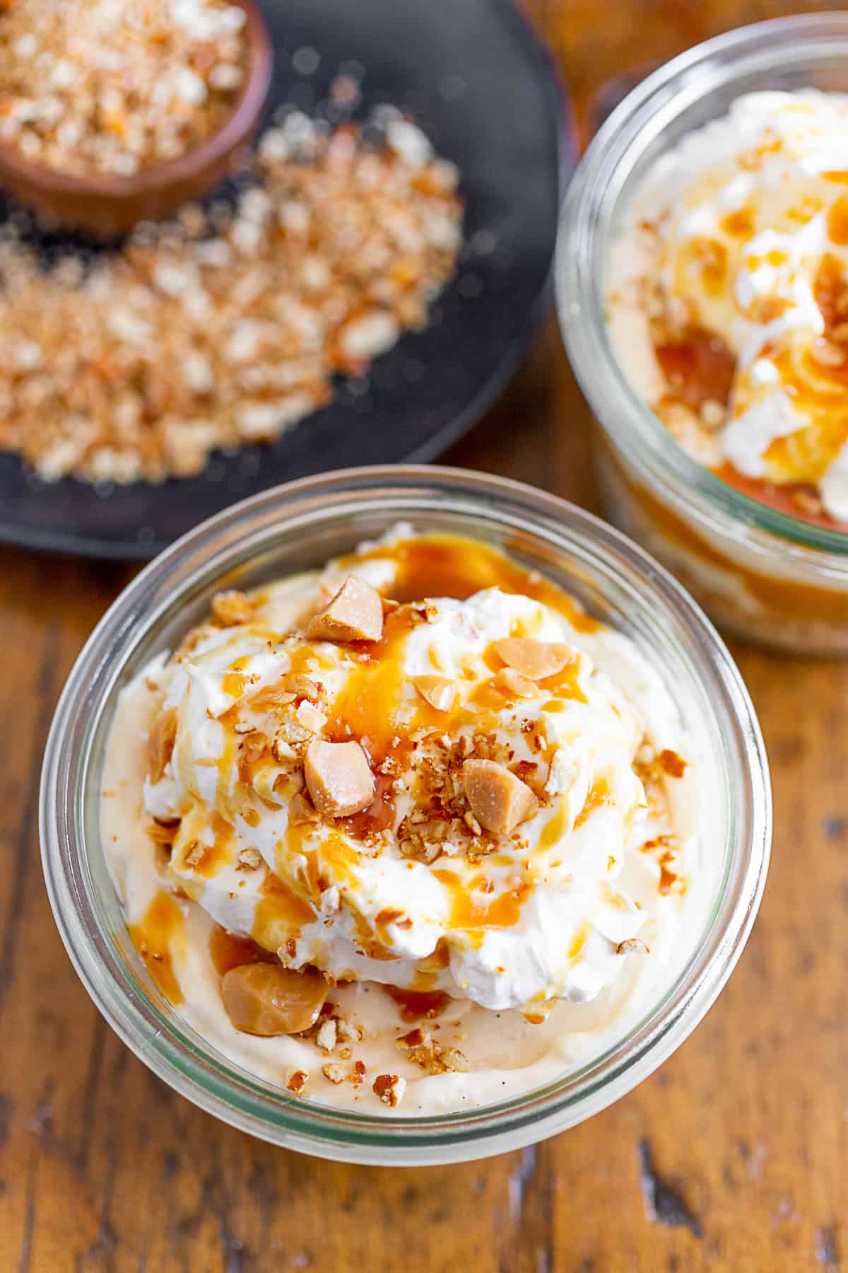 No Bake Caramel Cheesecake topped with whipped cream.