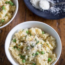 This pea Parmesan risotto is minimal stir and turns out perfectly creamy. It's packed full of fresh lemon zest, sweet spring peas and sharp Parmesan cheese.