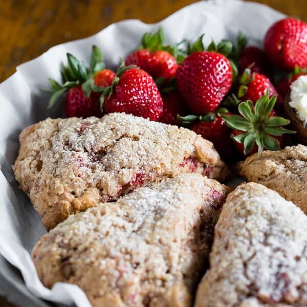 These roasted strawberry Greek yogurt scones are packed full of fresh roasted berries, vanilla Greek yogurt and made with white whole wheat flour! So easy to make and perfect for a lazy Sunday breakfast treat.