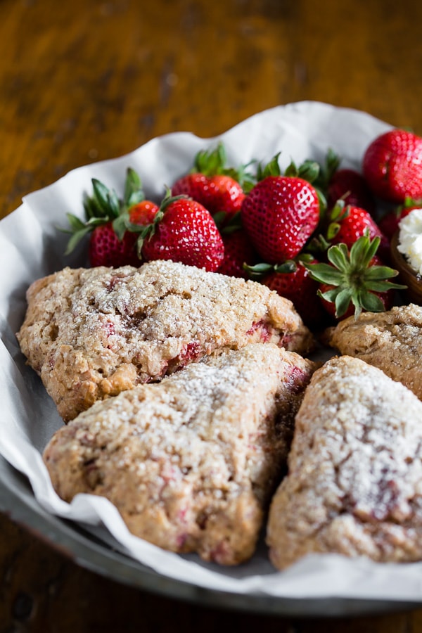 These roasted strawberry Greek yogurt scones are packed full of fresh roasted berries, vanilla Greek yogurt and made with white whole wheat flour! So easy to make and perfect for a lazy Sunday breakfast treat.