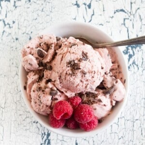 This raspberry chocolate chip ice cream is the perfect addition to your summer menu. Slightly sweet, full of fresh berry flavor and packed with dark chocolate chips. You'll love how easy it is to make your own ice cream!