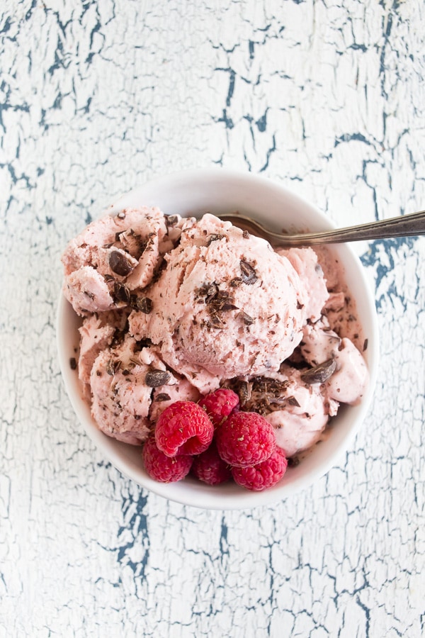 Raspberry Chocolate Chip Ice Cream served with sprinkled chocolate and fresh berries. 