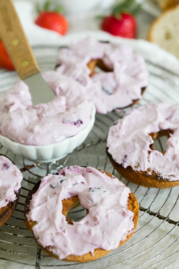 Berry Cream Cheese spread on top of bagels. 