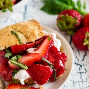 This strawberry basil shortcake is the perfect summertime dessert. Tender shortcake biscuits topped with homemade strawberry jam, macerated berries with basil and fresh whipped cream. So easy and delicious you'll want to make it all summer long.