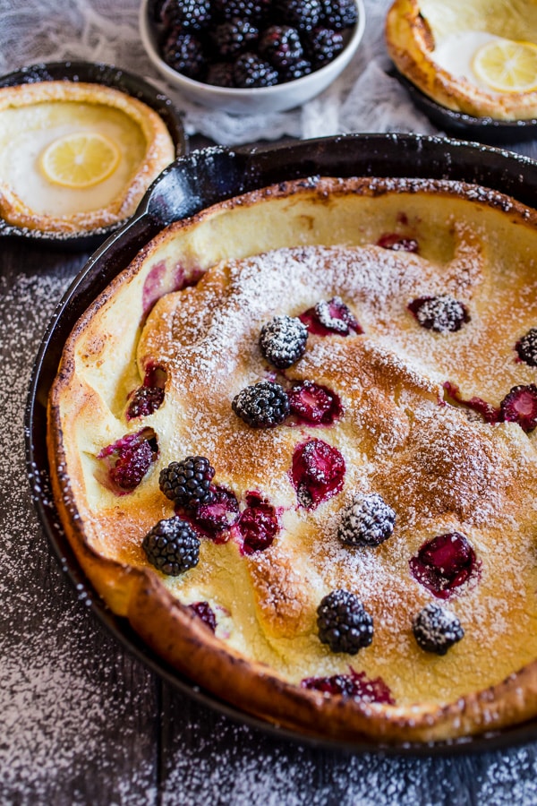 Blackberry Lemon Dutch Baby dusted with powdered sugar.