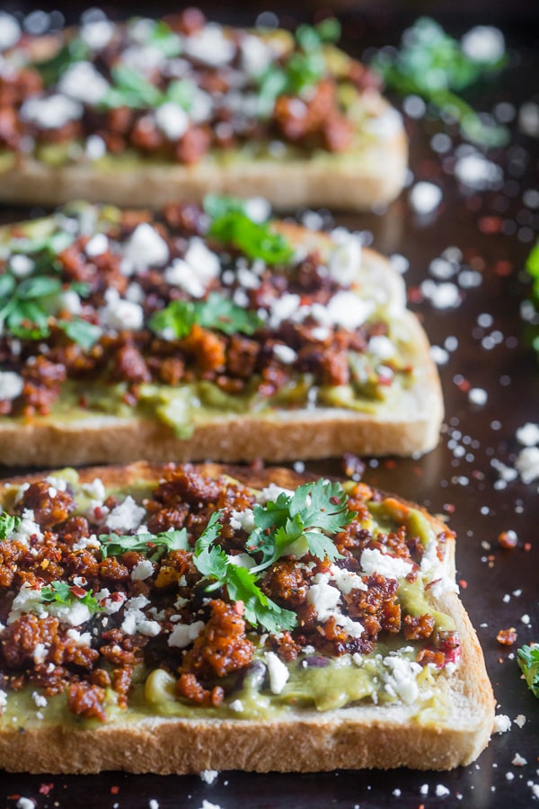 This chorizo cotija guacamole toast is a great way to start the day OR a delicious mid-day treat. Savory guacamole mixed with fresh vegetables and topped with spicy chorizo, salty cotija and a sprinkling of cilantro. You're going to go crazy over this delicious toast!
