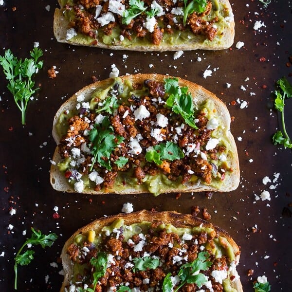This chorizo cotija guacamole toast is a great way to start the day OR a delicious mid-day treat. Savory guacamole mixed with fresh vegetables and topped with spicy chorizo, salty cotija and a sprinkling of cilantro. You're going to go crazy over this delicious toast!