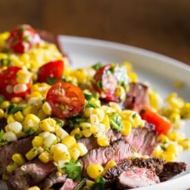 This grilled London broil with corn salsa captures the flavor of summer. Simply grilled London broil topped with a citrusy corn and tomato salsa. Super easy and ready in just 20 minutes!
