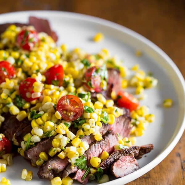 This grilled London broil with corn salsa captures the flavor of summer. Simply grilled London broil topped with a citrusy corn and tomato salsa. Super easy and ready in just 20 minutes!