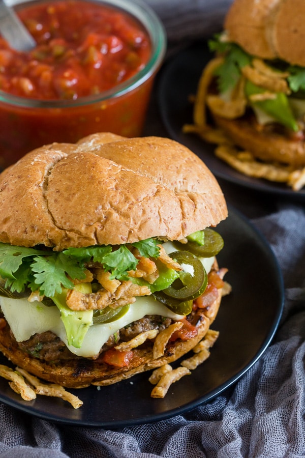 Baja Burger topped with cheese and cilantro. 