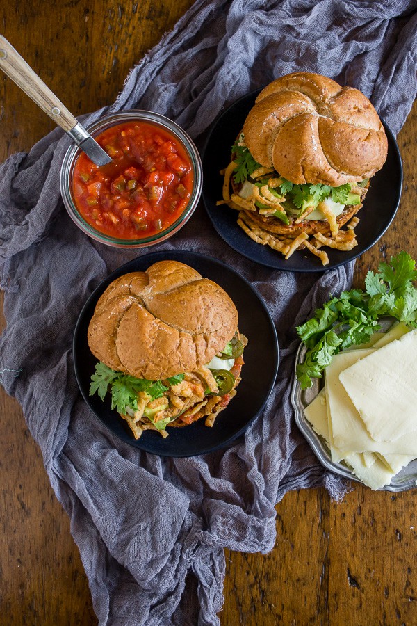 Baja Burger sitting on a table with a grey napkin. 