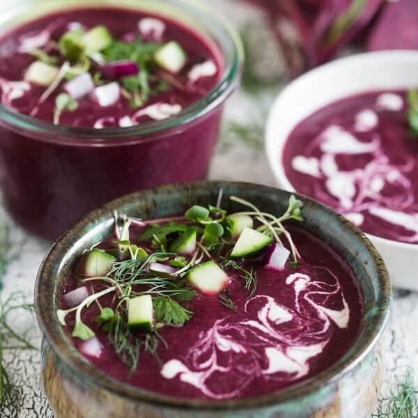 This summery beet gazpacho is packed full of vegetables and topped with fresh herbs, fresh chopped vegetables and a drizzle of Greek yogurt. You'll love how simple this soup is to throw together and it's perfect for hot summer nights.
